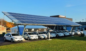 Figure 4. Vehicles charging with solar power. Credit: Sass Peress, Renewz Sustainable Solutions Inc., via Wikimedia Commons