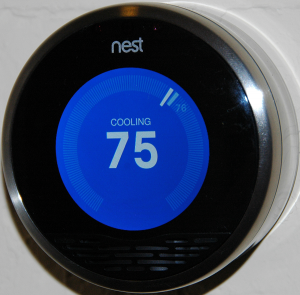 Figure 4 Image of an installed learning thermostat. Credit: <a title="A smart thermostat" href="https://en.wikipedia.org/wiki/Nest_Labs#/media/File:Nest_front_official.png" target="_blank">Wikimedia Commons, CC BY-SA 3.0</a>.