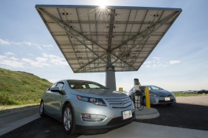 June 11, 2013 - Plug-in hybrid electric vehicles charge at the rapid charging system powered by a solar canopy at the Vehicle Testing and Integration Facility (VTIF) at NREL. (Photo by Dennis Schroeder / NREL)