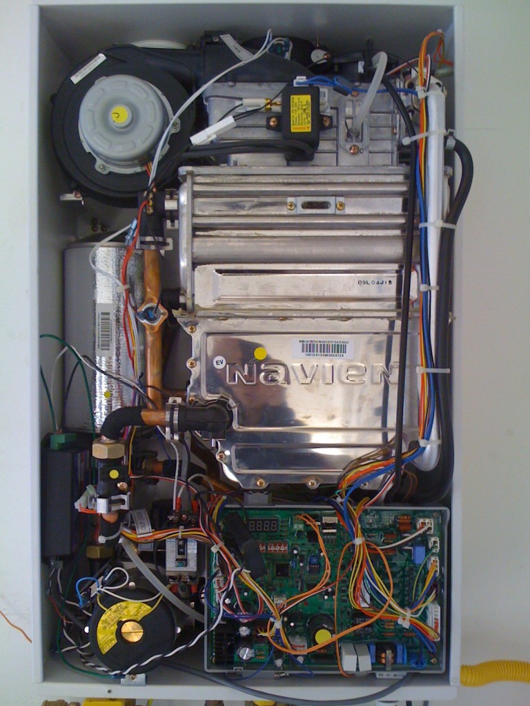 Figure 3. The modular components of a tankless water heater allow for increased accessibility to internal system parts for system servicing and parts replacement. Credit: Lieko Earle, NREL.